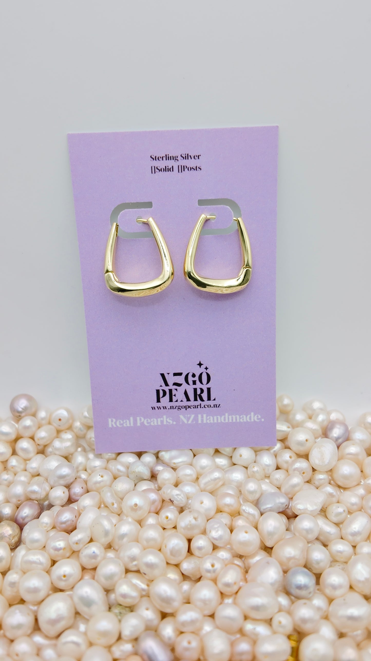 Modern Curve Huggie Earrings