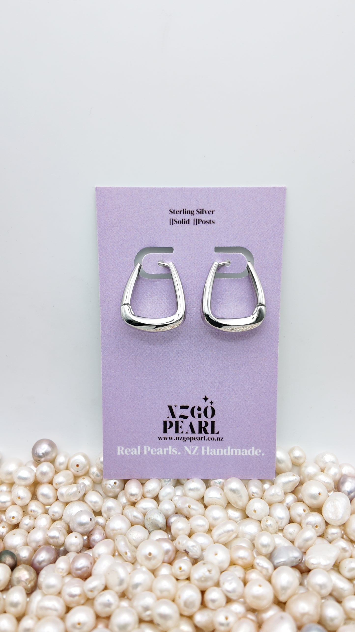 Modern Curve Huggie Earrings