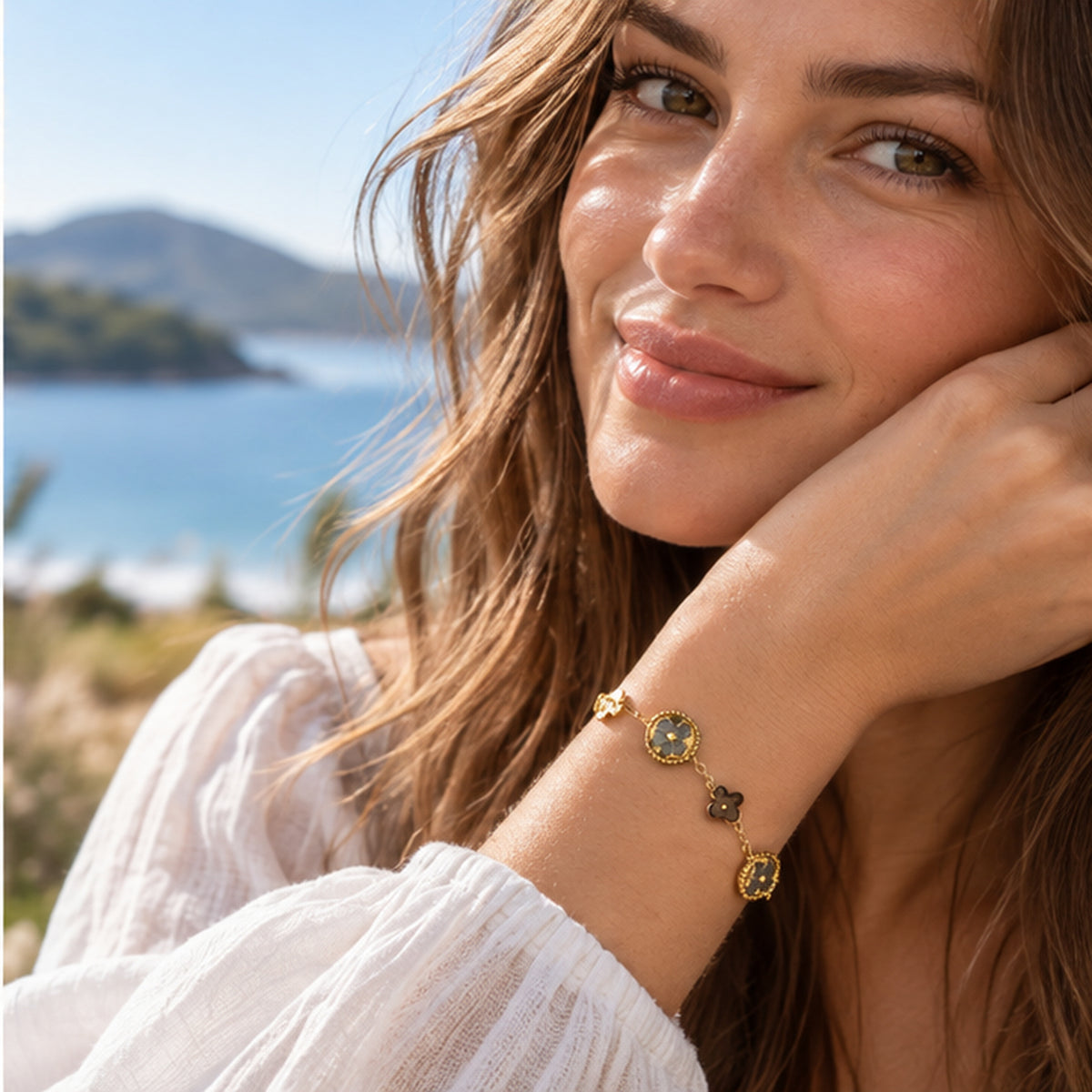 Mother of pearl clover bracelet worn on the wrist