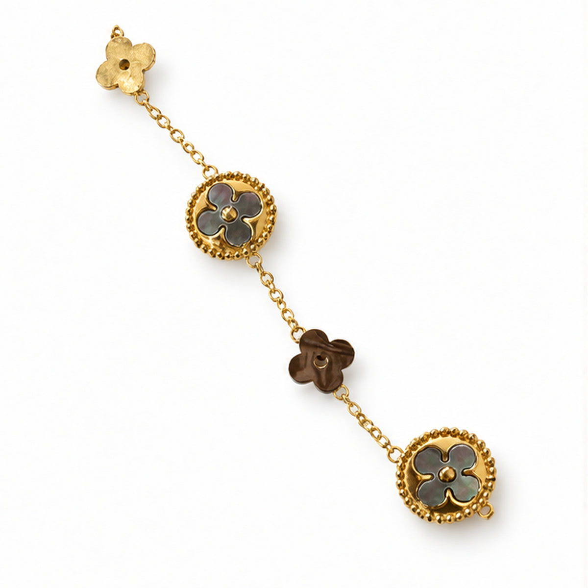 Mother of pearl clover bracelet on a clean light background
