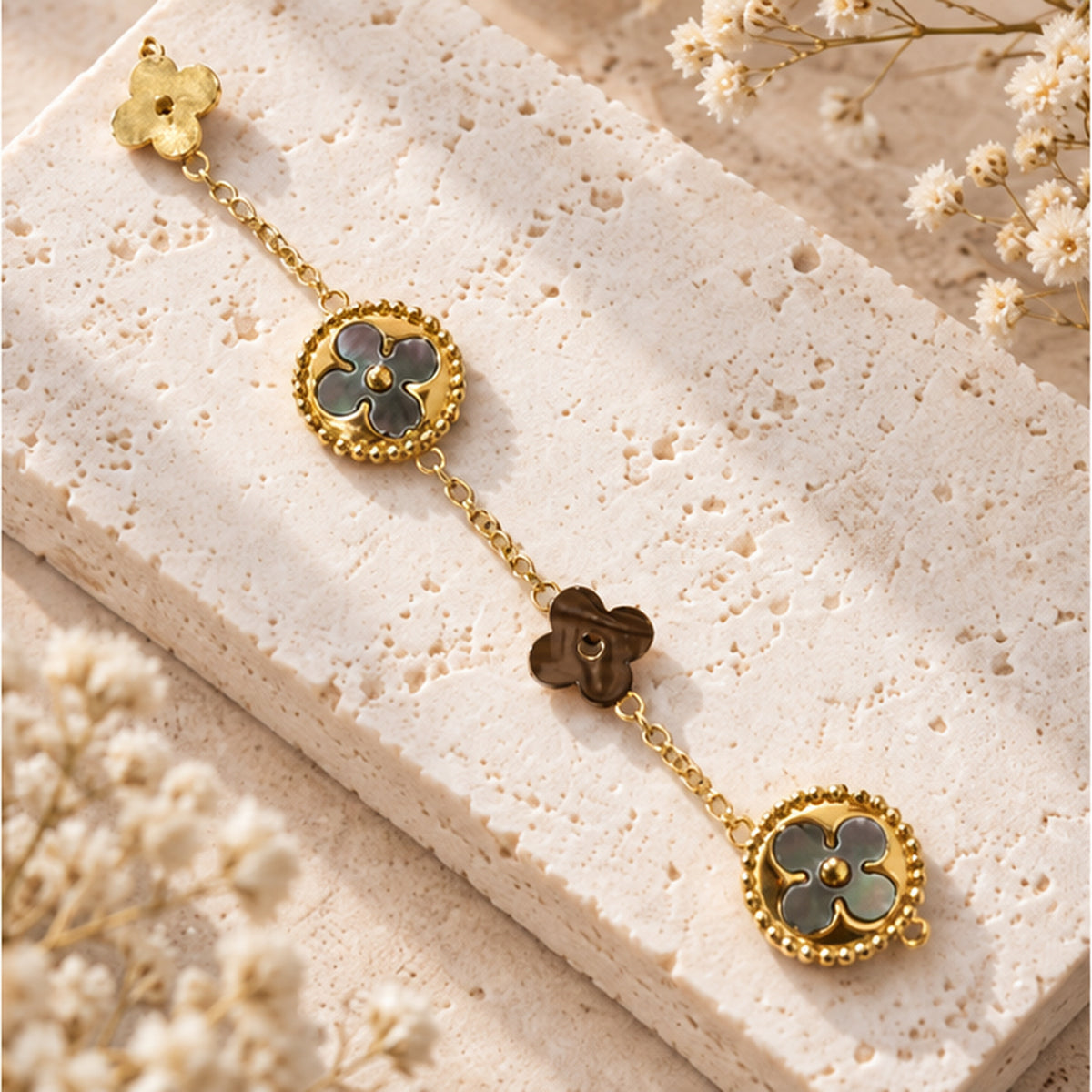 Mother of pearl clover bracelet styled on neutral stone