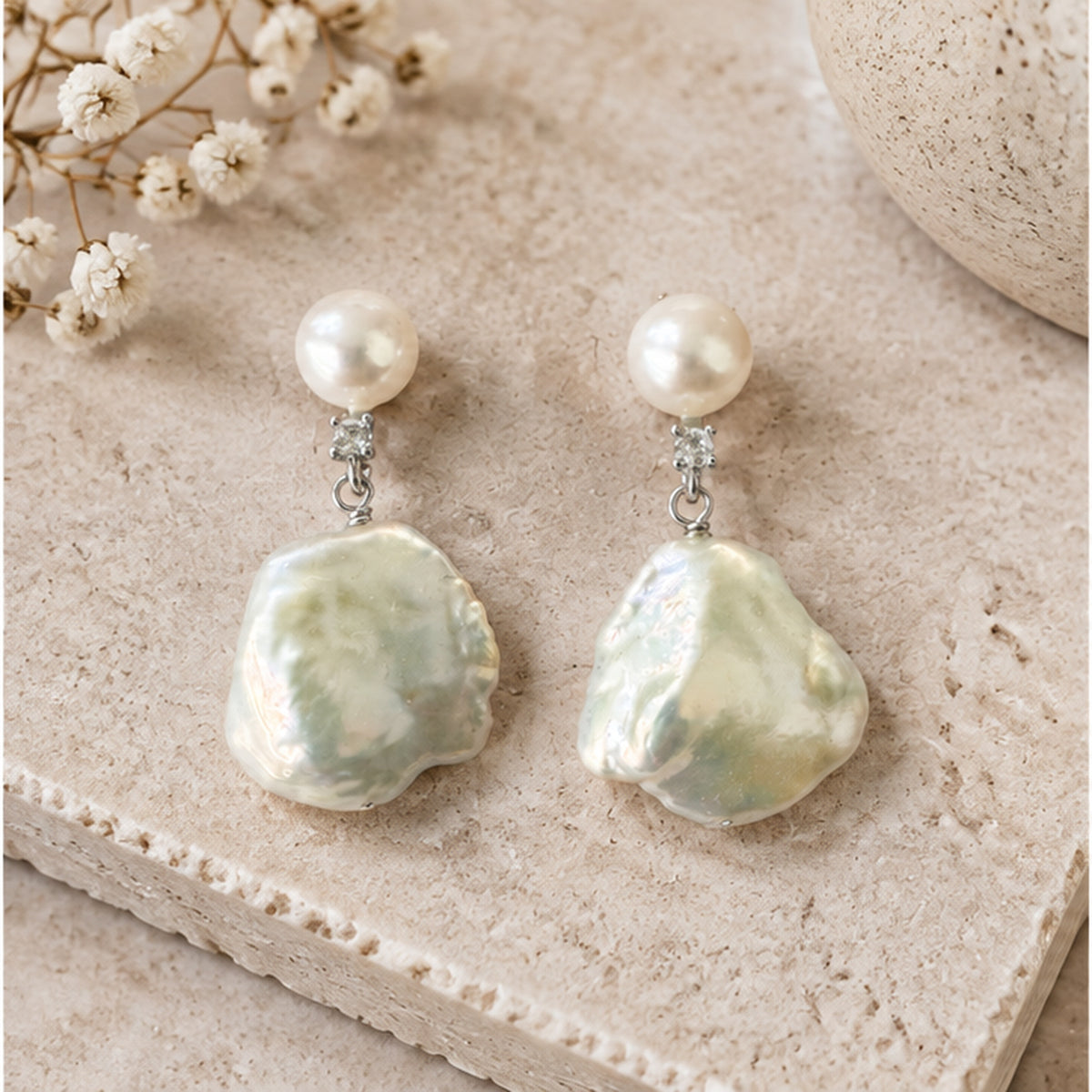 NZGO Pearl baroque real pearl drop earrings styled on neutral stone