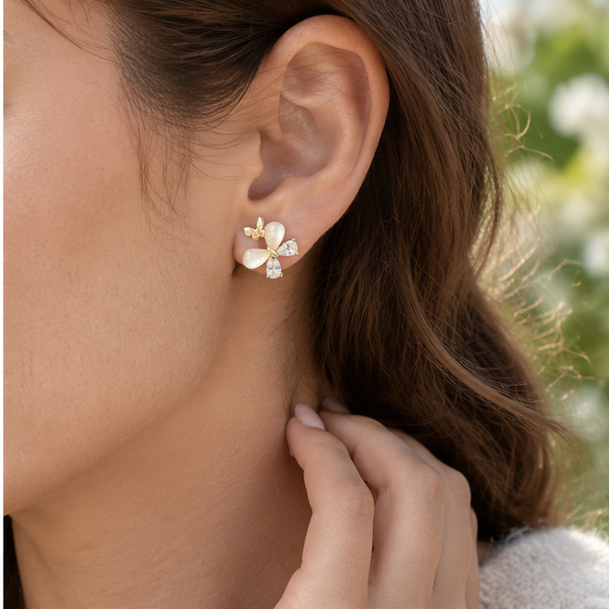 NZGO Pearl Cat's Eye butterfly stud earring worn at realistic scale