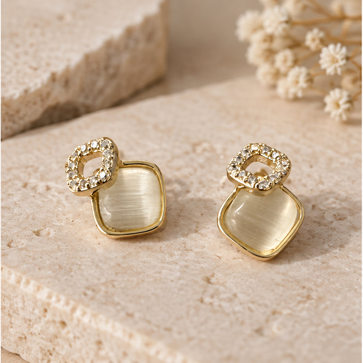 NZGO Pearl Cat's Eye square stud earrings in a neutral studio setting