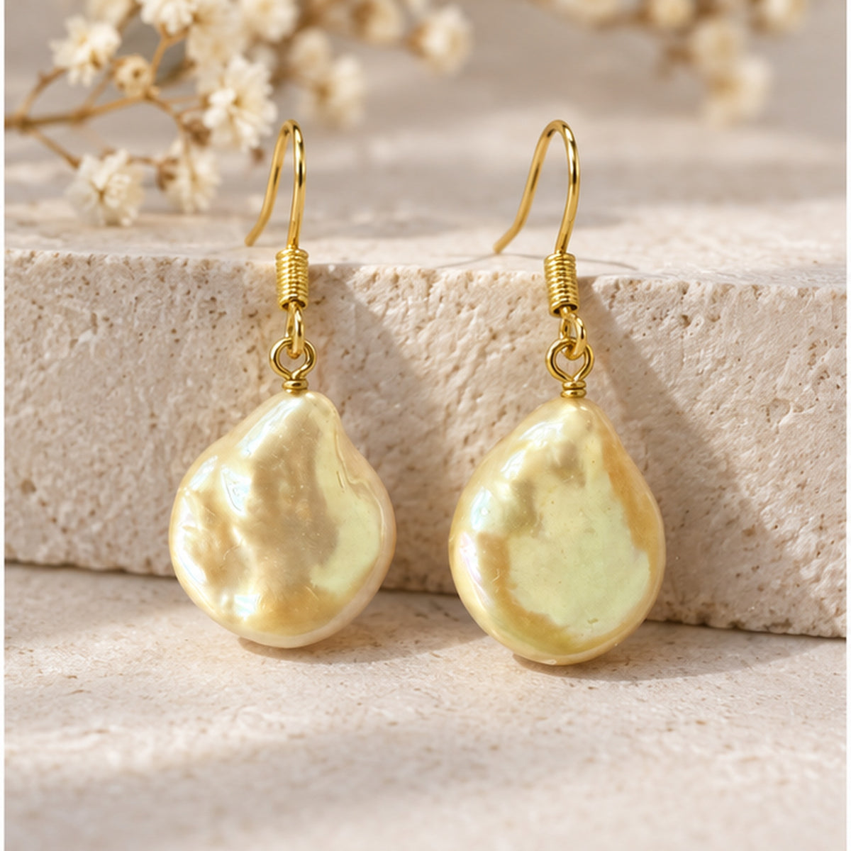 NZGO Pearl champagne baroque real pearl drop earrings in a neutral studio setting