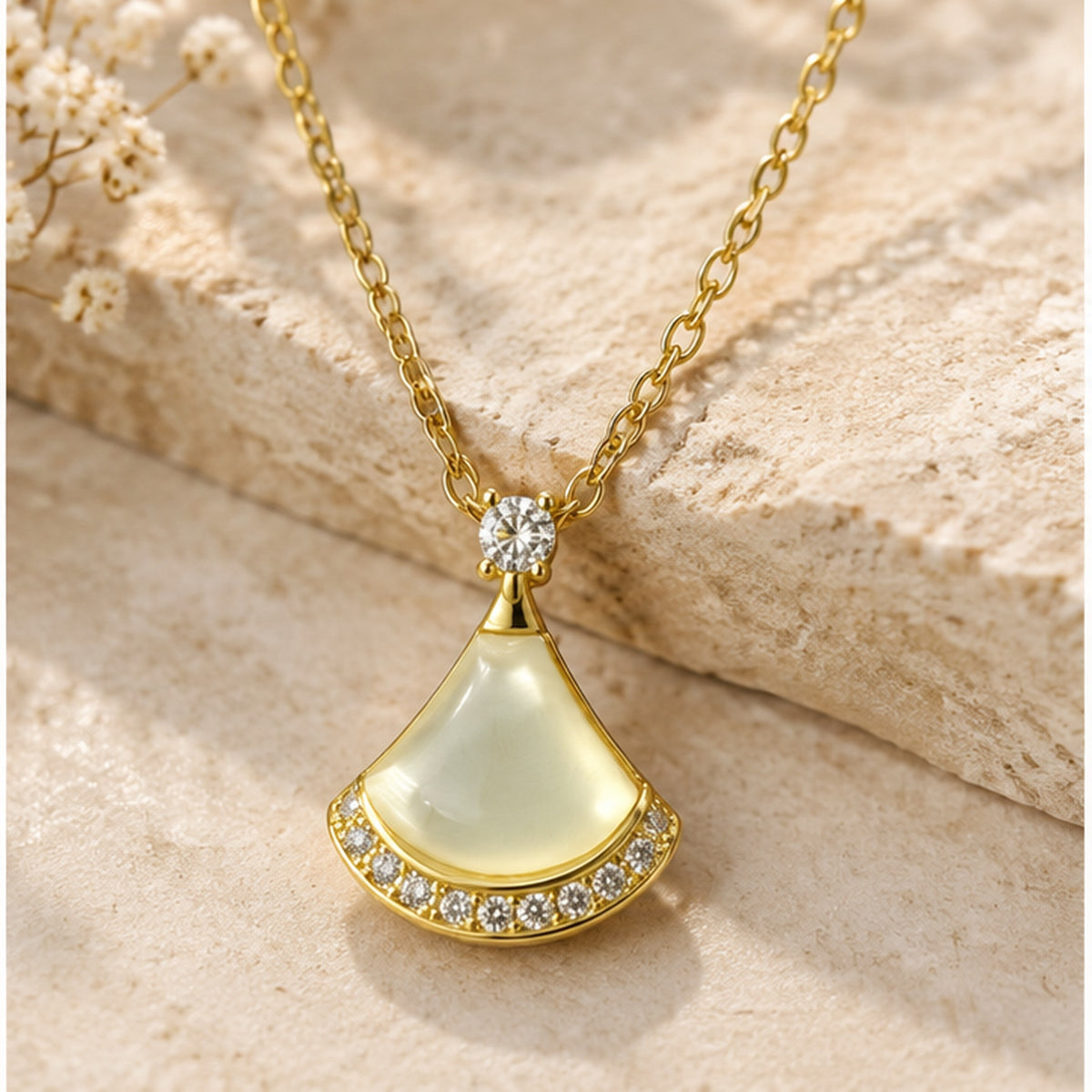 NZGO Pearl fan crystal pendant necklace in a neutral studio setting