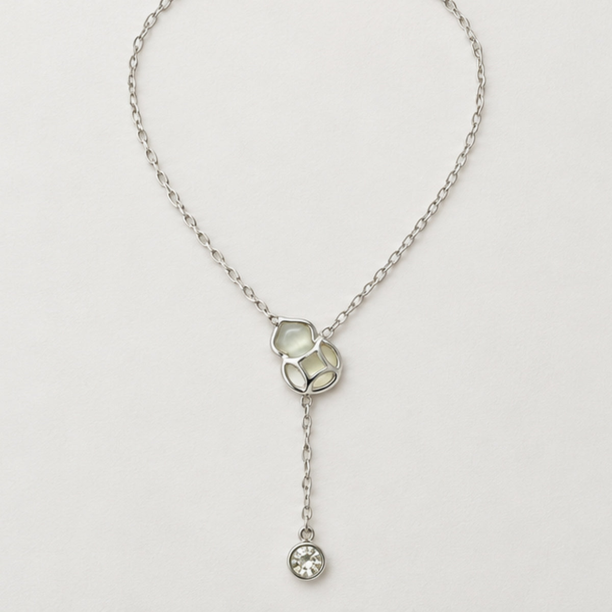 NZGO Pearl lattice crystal drop Y necklace in a neutral studio setting