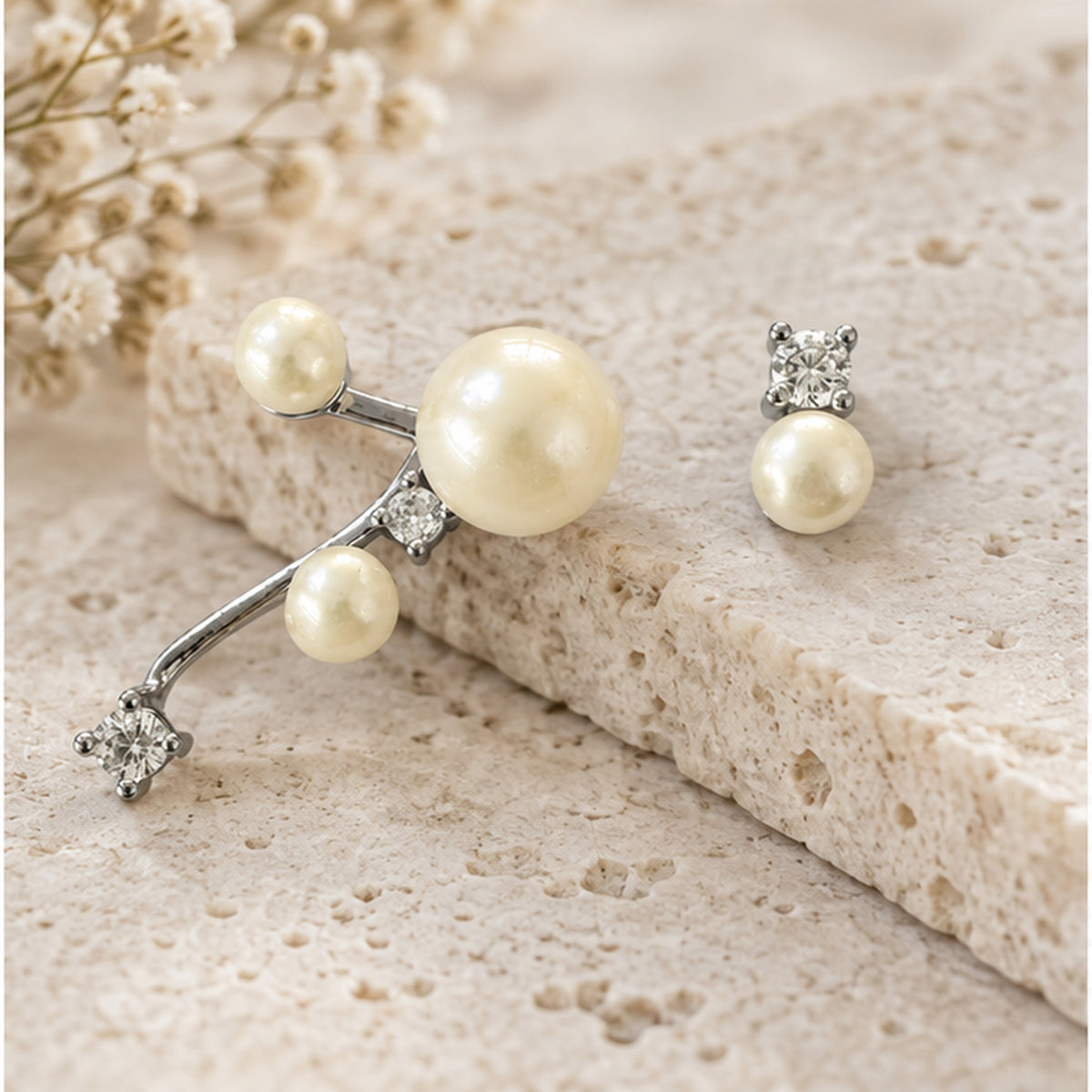 NZGO Pearl real pearl asymmetric silver earrings styled on neutral stone