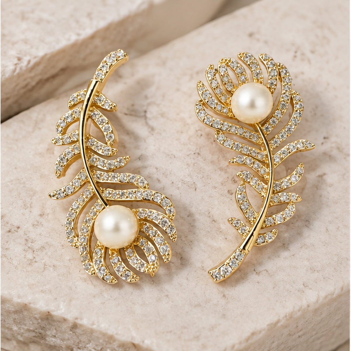 NZGO Pearl real pearl crystal feather earrings in a neutral studio setting