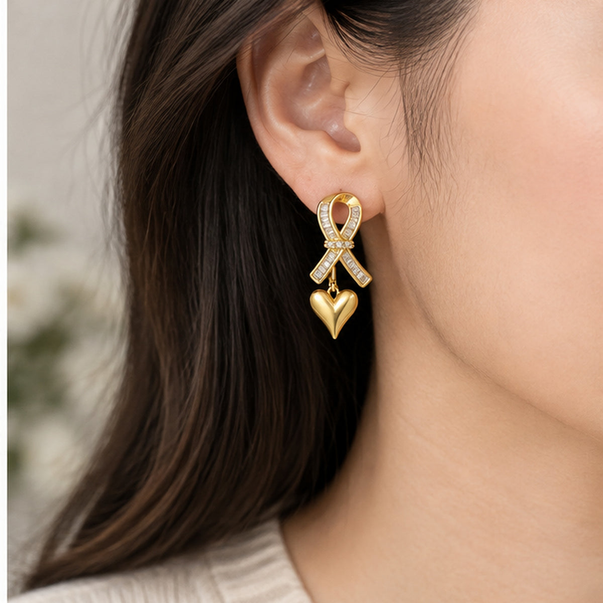 NZGO Pearl ribbon heart drop earring worn at realistic scale