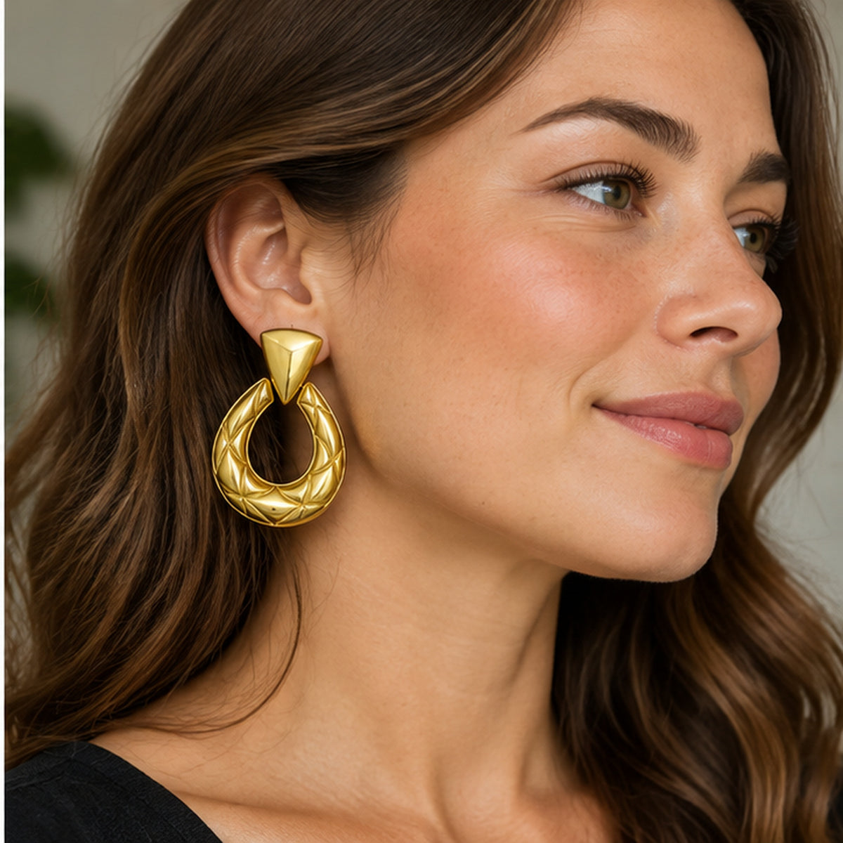 NZGO Pearl sculptural horseshoe statement earrings worn at realistic scale