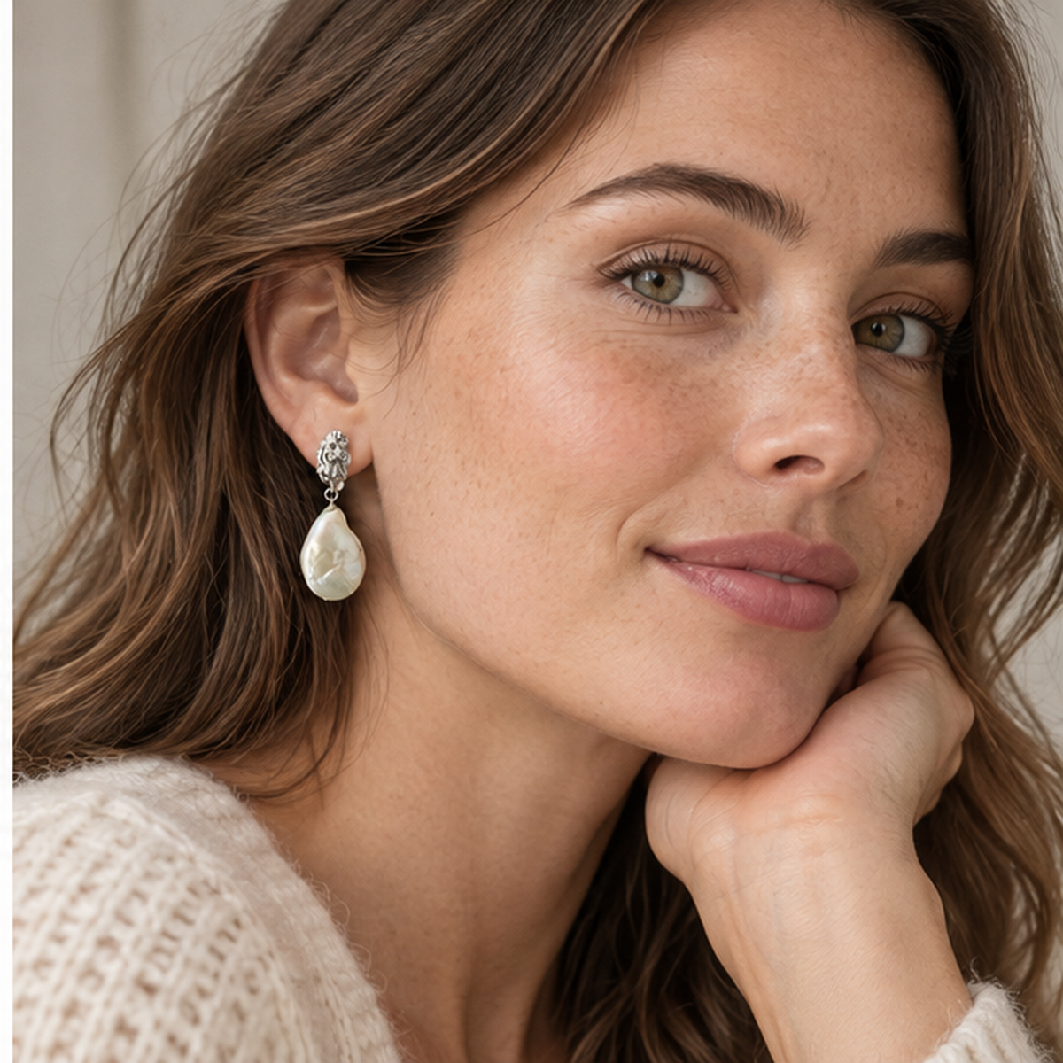 NZGO Pearl sculptural silver baroque pearl drop earrings worn by model