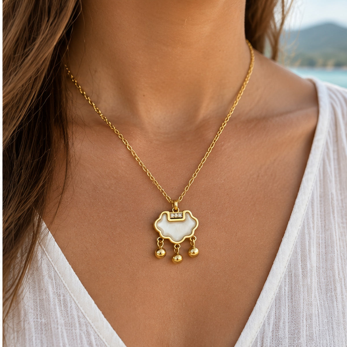 NZGO Pearl three-drop cloud pendant necklace worn at realistic scale
