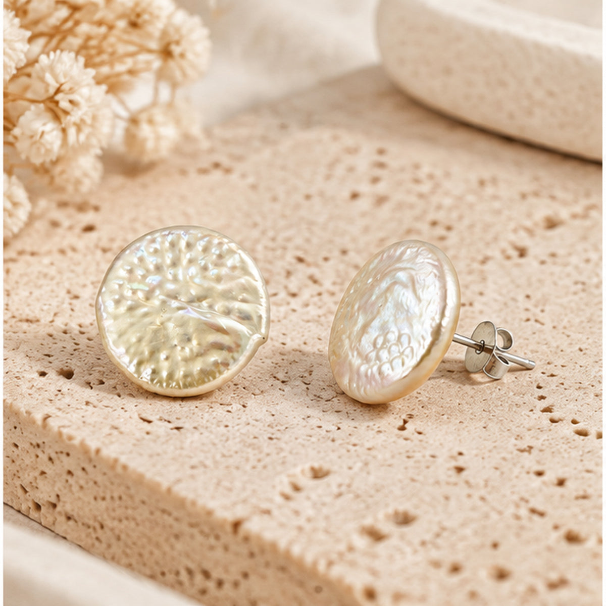 Real dragon scale pearl stud earrings with solid sterling silver posts in a neutral studio setting