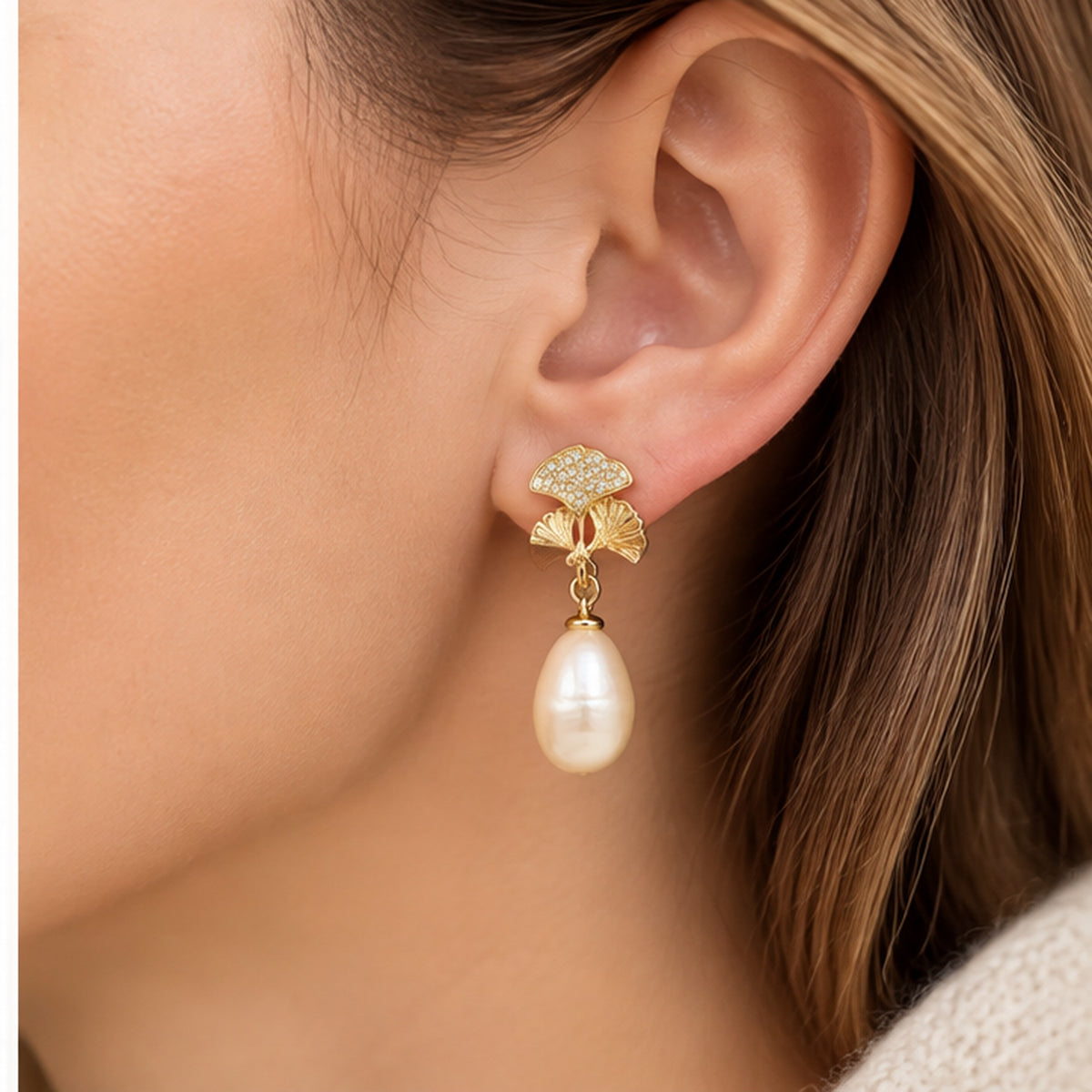Ginkgo leaf real pearl drop earring worn on a model at realistic scale