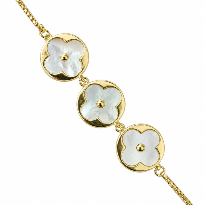 Gold-tone bracelet with real mother-of-pearl floral disc centres