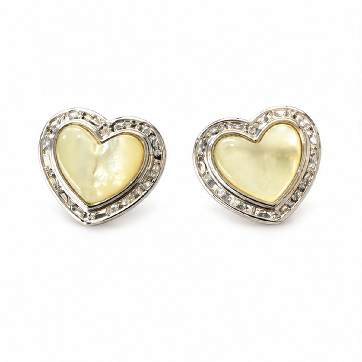Mother of pearl heart stud earrings with solid sterling silver posts and sparkling clear stone accents on a clean white background