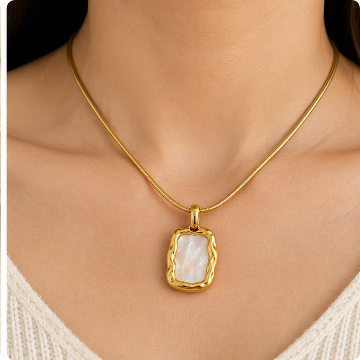 Organic mother of pearl rectangle pendant necklace in gold worn on the neck